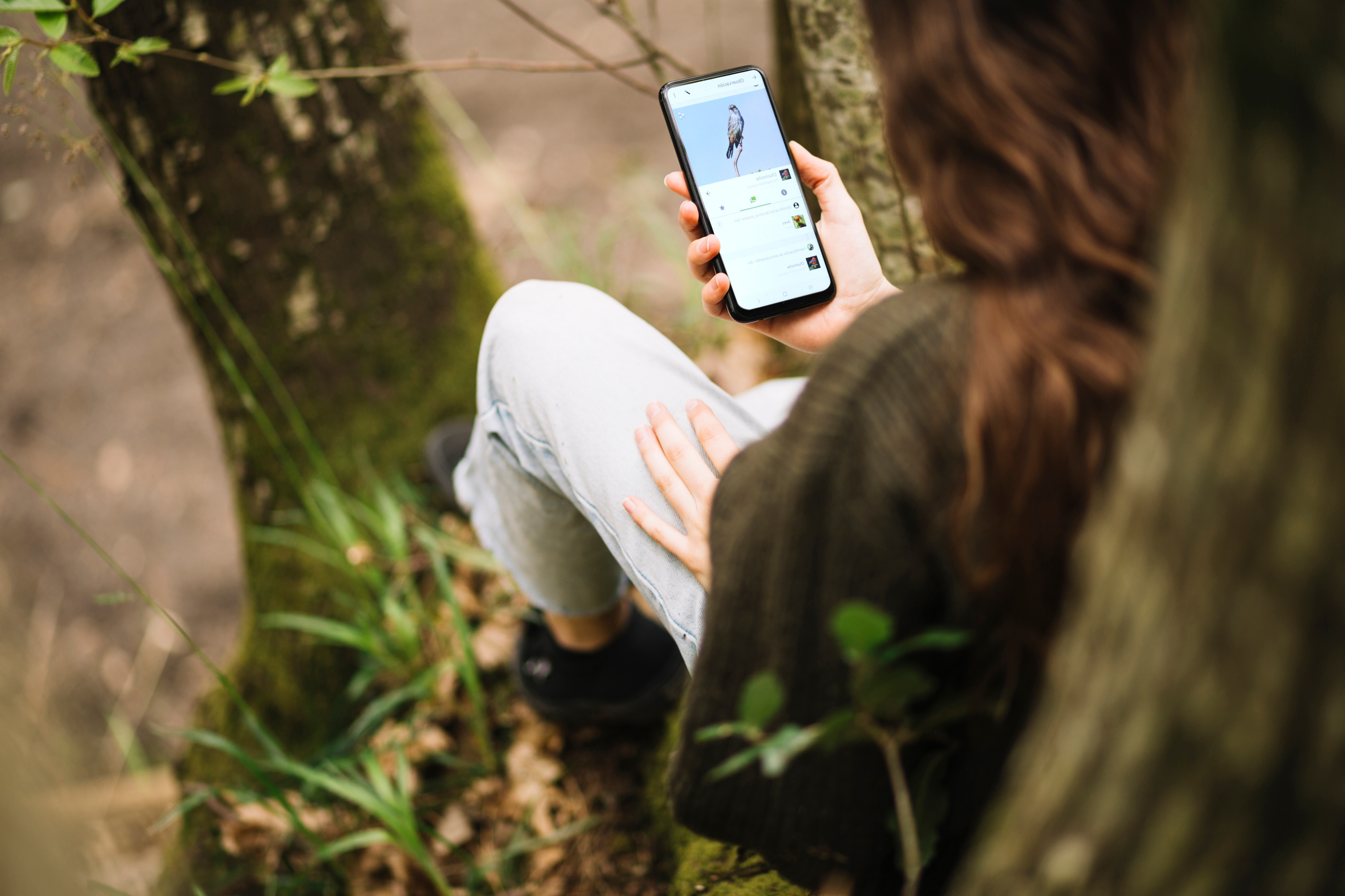 FREEPIK young woman with smartphone template nature copy