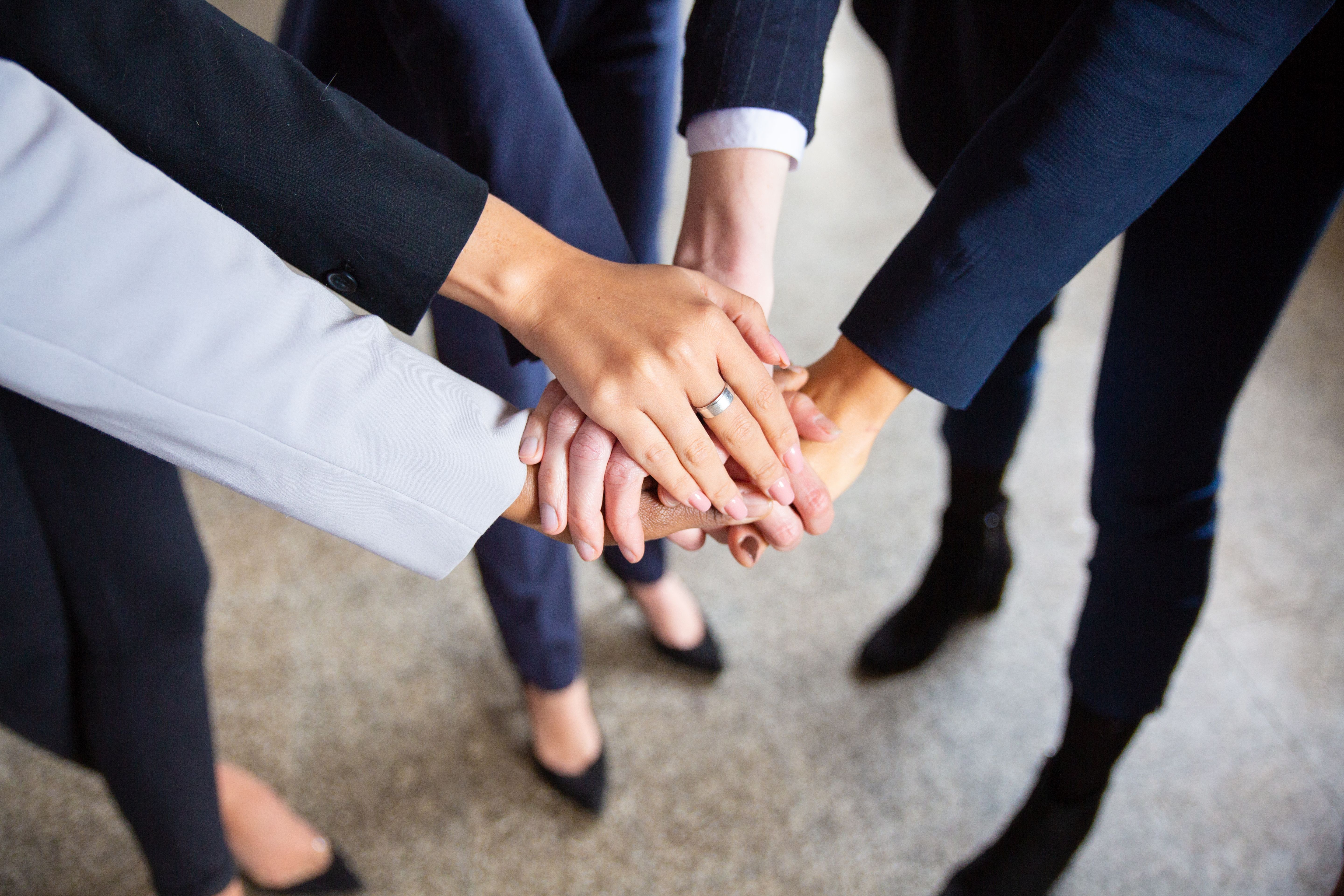 Cropped shot of women putting hands together in circle. Closeup shot of female hands. Teamwork concept